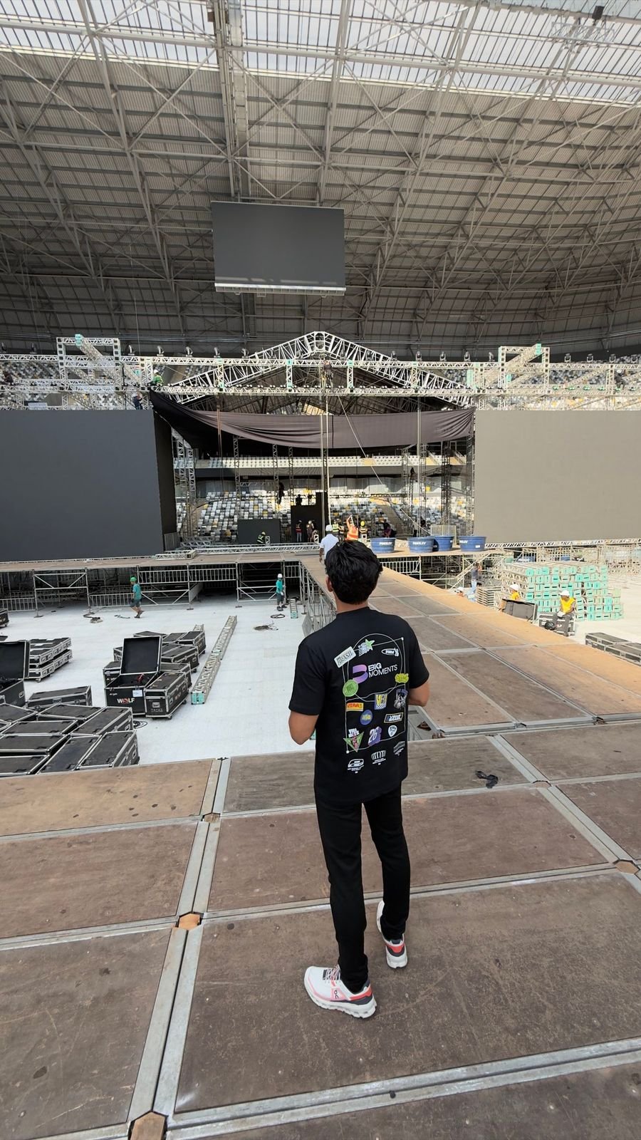 Stage load-in inside an empty stadium